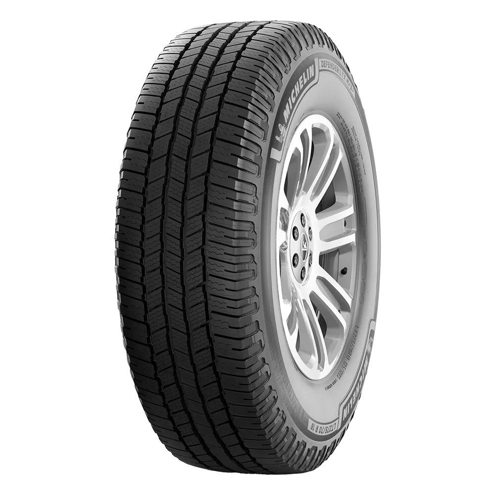 A Michelin black tire with detailed tread patterns mounted on a silver alloy wheel.