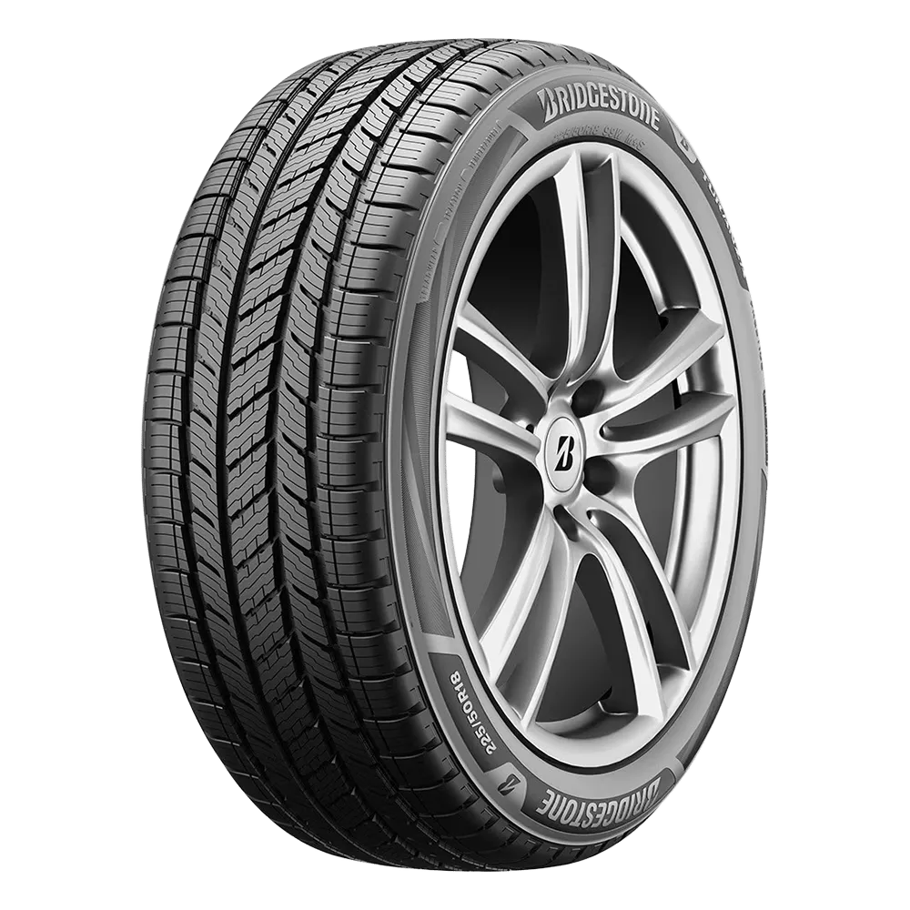 A Bridgestone car tire with a detailed tread pattern and alloy wheel rim.