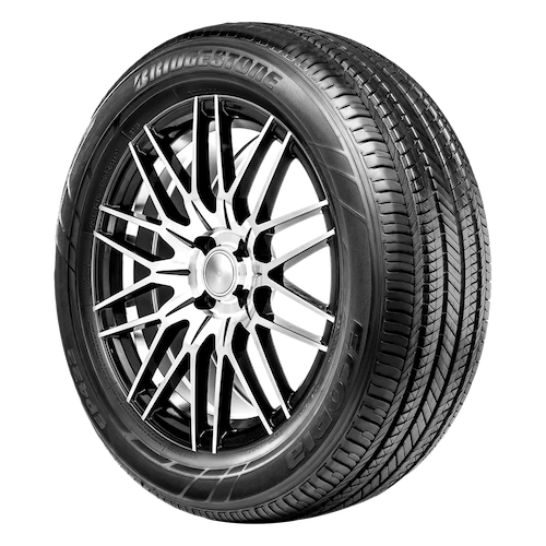 A close-up image of a Bridgestone tire featuring a detailed tread pattern and a metal alloy wheel with a complex, multi-spoke design.