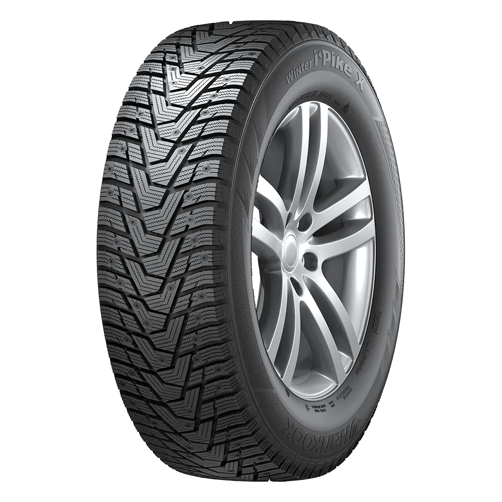 A Hankook winter i pike x tire mounted on an aluminum alloy wheel with visible pinholes for studs.