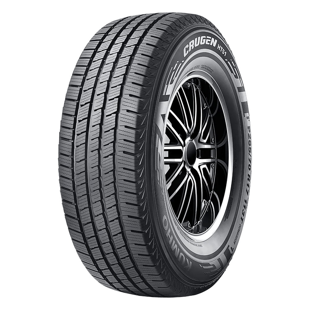 A black Kumho Crugen HT51 tire with a detailed tread pattern, mounted on a shiny alloy wheel.