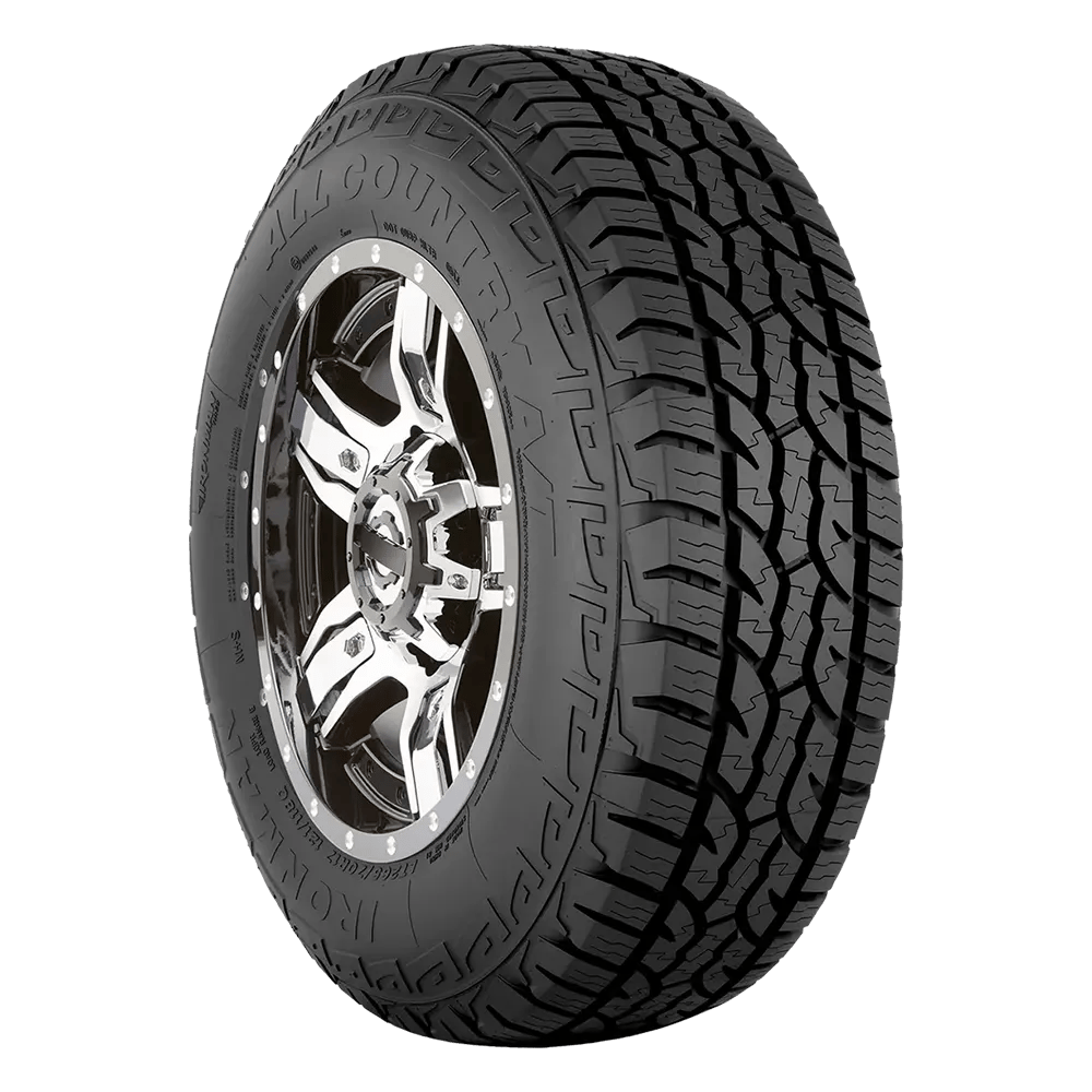 A black all-terrain tire with rugged tread and the words 'All Country' and 'Ironman' visible on the sidewall, mounted on a shiny chrome wheel.