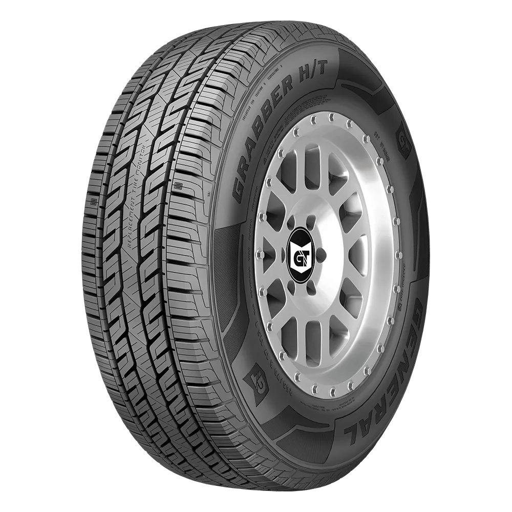A close-up of a General Grabber H/T tire with a detailed tread pattern and visible brand markings on the sidewall.