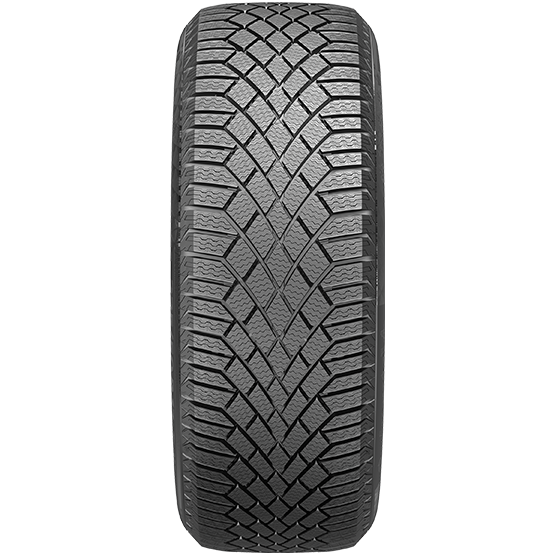 A close-up view of a winter car tire with a detailed tread design, showcasing strong V-shaped patterns for enhanced traction.