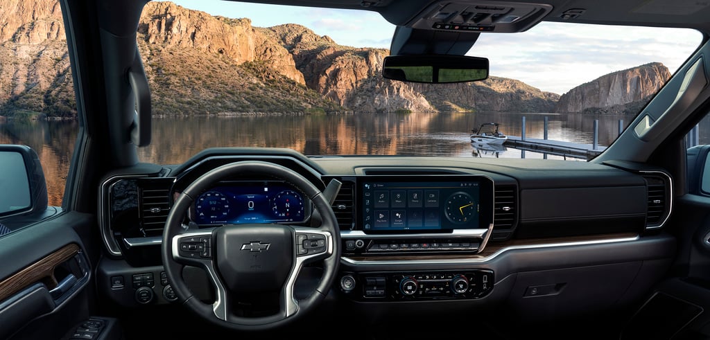 Front-facing view of the 2026 Chevrolet Silverado 1500 RST interior parked in front of a lake.
