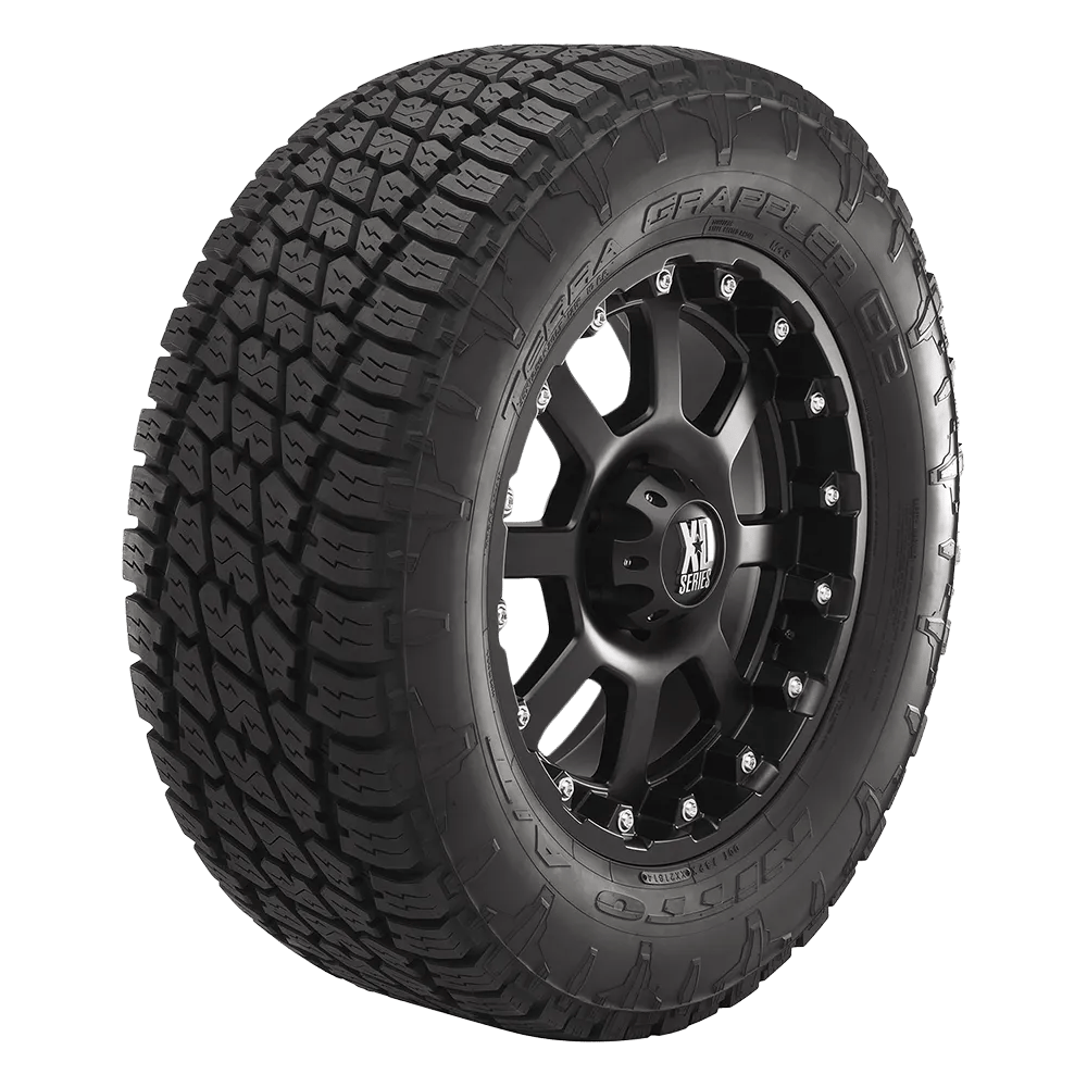Photo of a side facing Nitto Grappler G3 tire mounted on an XD series gloss black milled rim.