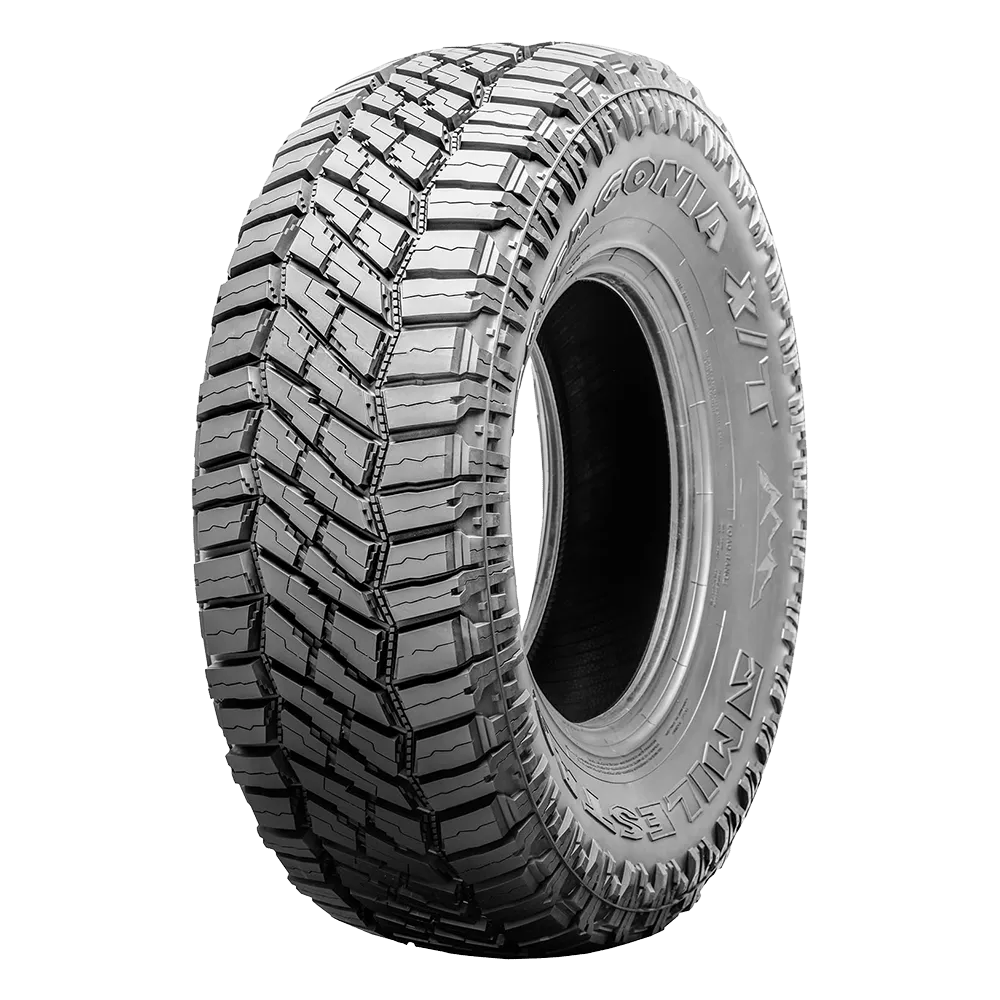 A Milestar Patagonia x/t tire from the front-side view, not installed on a wheel. 