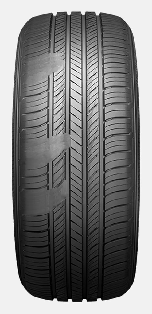 A car tire with a symmetrical tread pattern and cupping damage from uneven wear.