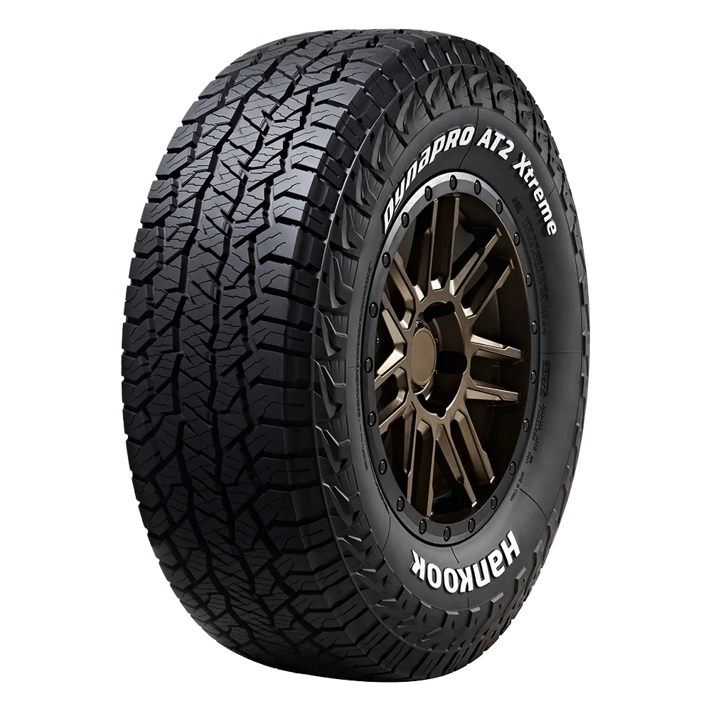 A Dynapro AT2 Xtreme tire is mounted on a bronze coated wheel with seven split spokes.