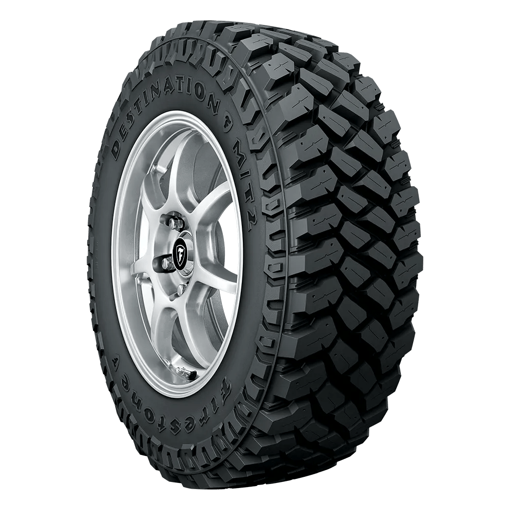 Left front facing Firestone Destination MT2 tire for a silverado mounted on a polished chrome rim.