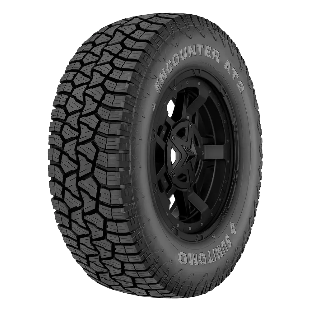 Photo of an Encounter AT2 tire mounted on a black rim with a five-point star logo.