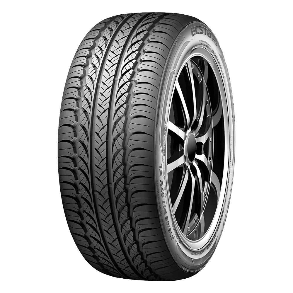 A detailed view of a black car tire with a textured tread pattern and a sleek black alloy wheel.
