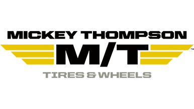 Mickey Thompson Tires & Wheels logo featuring black uppercase text "MICKEY THOMPSON" above large "M/T" with yellow wings, and "TIRES & WHEELS" below.